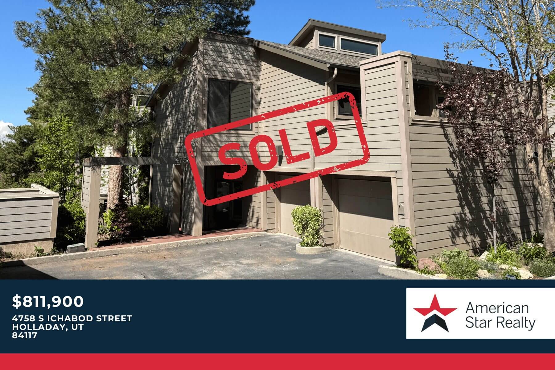 House with "SOLD" sign in front yard.