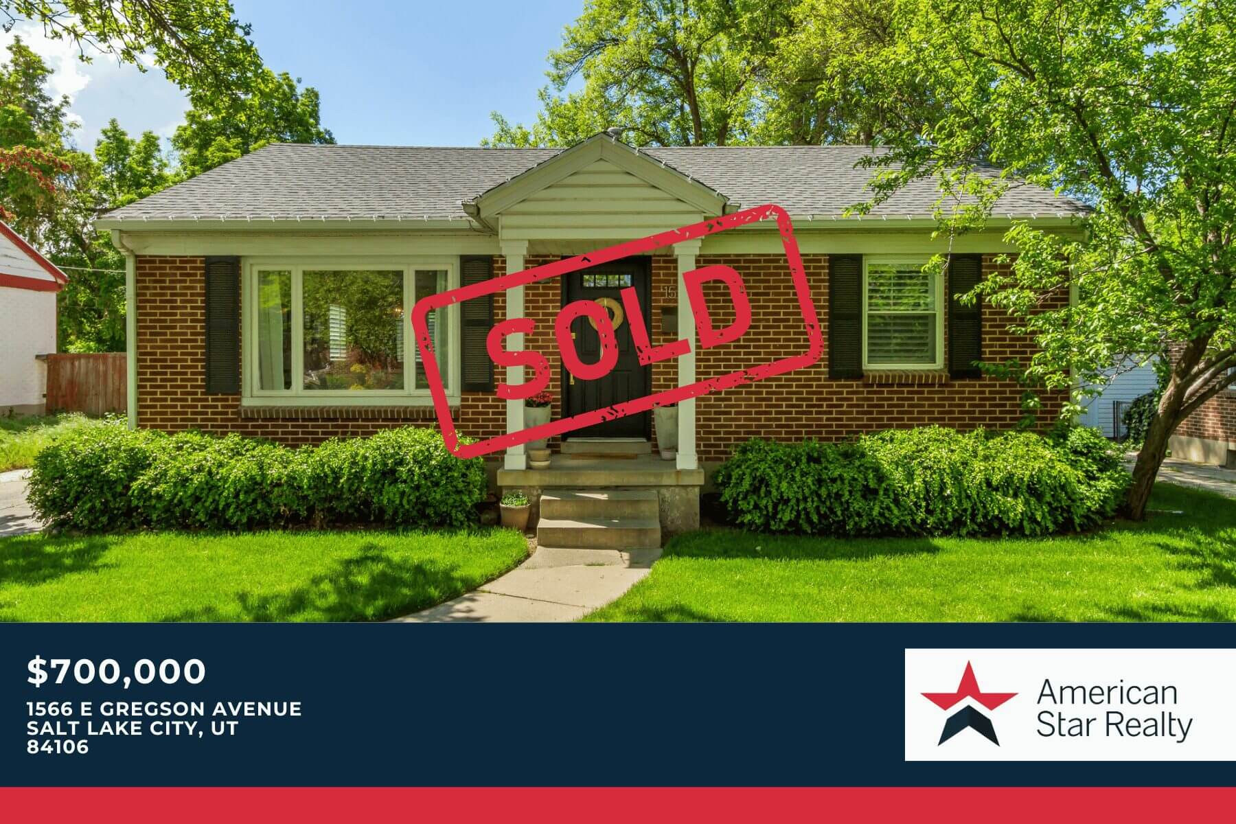 House with "Sold" sign in front yard.