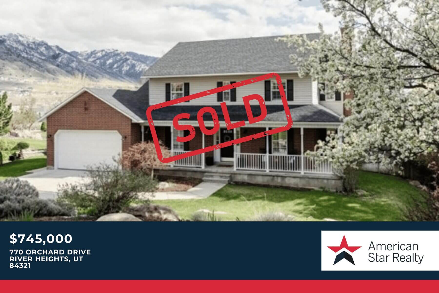 House with "Sold" sign and mountain backdrop.