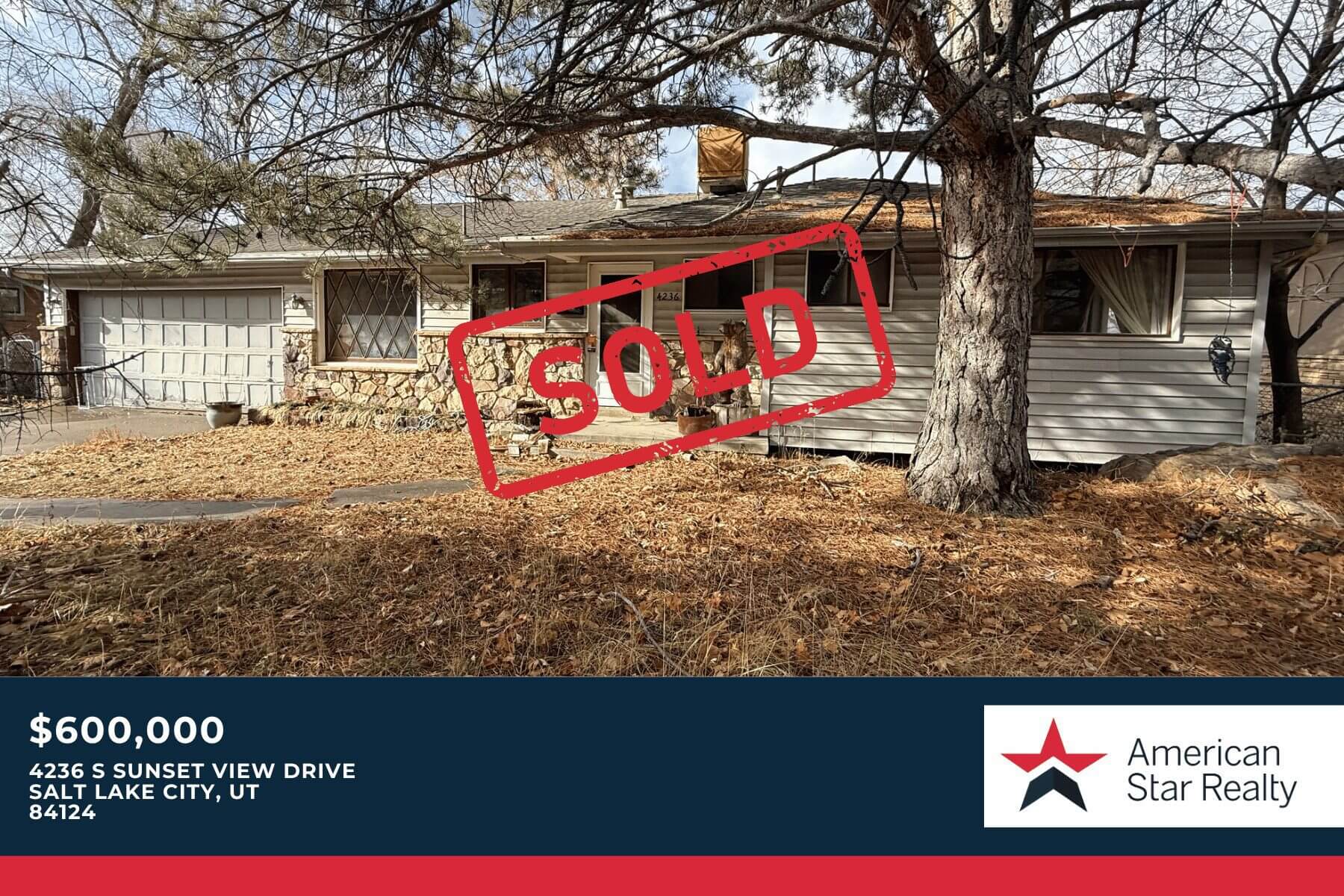 House with "Sold" sign and trees.