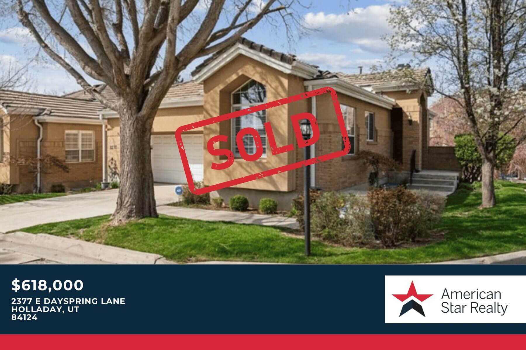House with "Sold" sign in front yard.