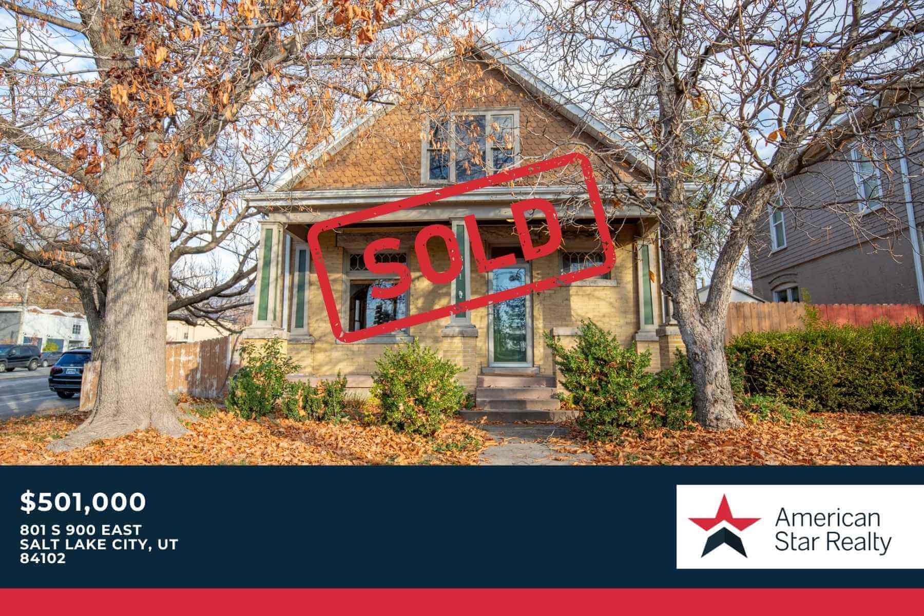 House with "Sold" sign, autumn scene.